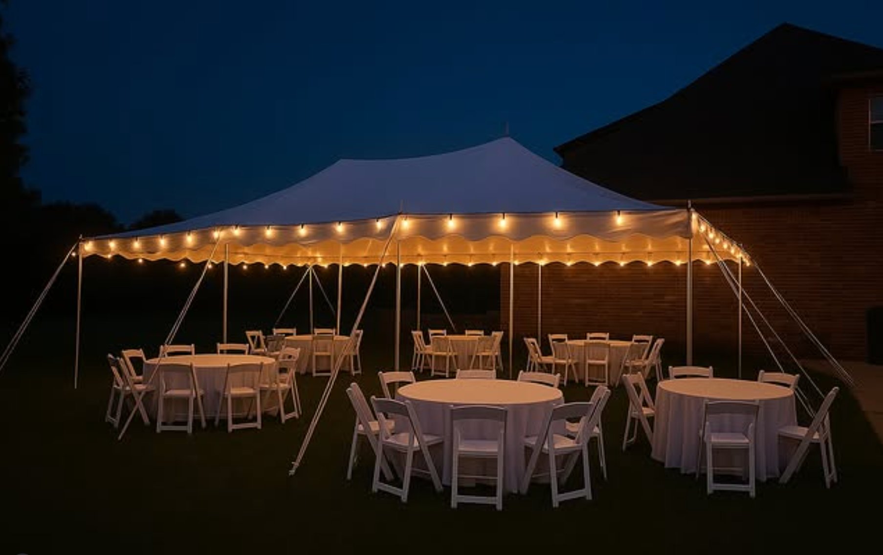 Rustic wedding tent with crossback chairs