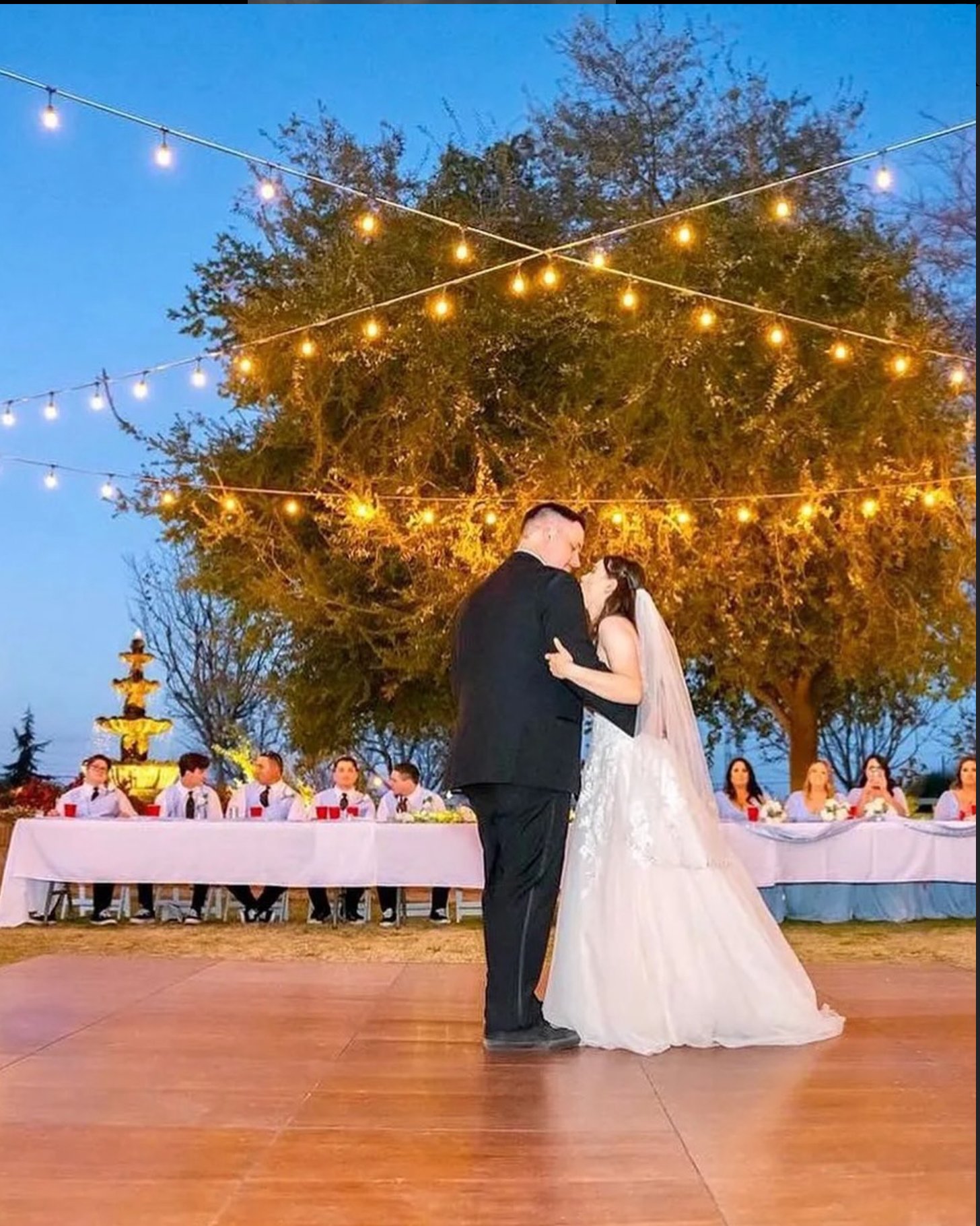 Wedding reception with dance floor under tent